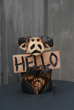 Load image into Gallery viewer, Moose chainsaw carving wood sculpture. one-of-a-kind unique rustic home decor, yard art garden accent table top office home or great gift idea. This adorable character carving features interchangeable "Hello" sign.