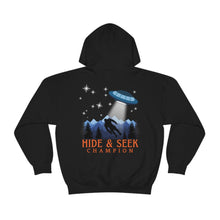 Load image into Gallery viewer, "Hide and Seek Champion" Bigfoot and UFO Alien Sweatshirt | Funny Hoodie | Mountain/Forest/Sasquatch/Spaceship Unisex Heavy Blend Hooded Sweatshirt - Jess Alice