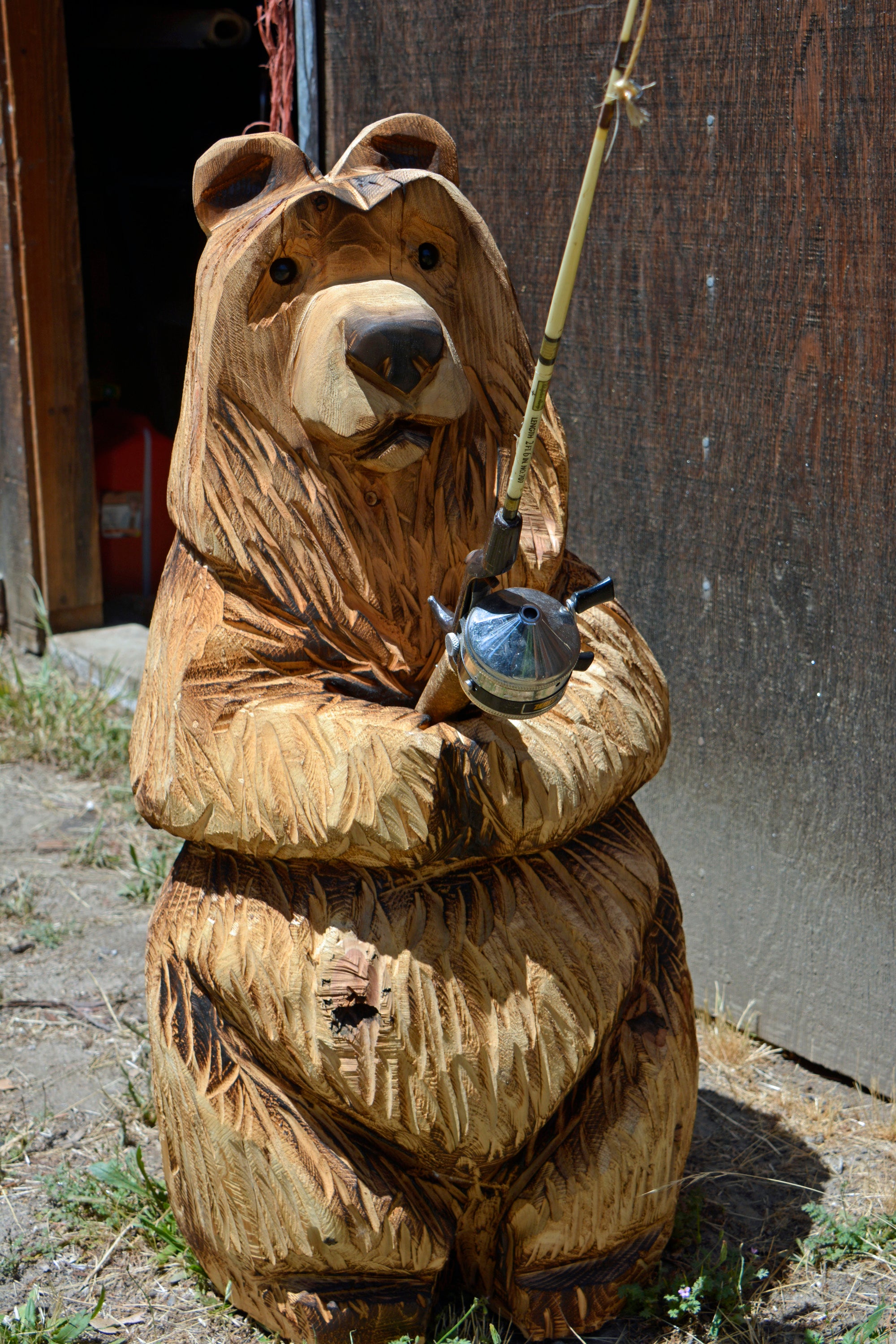 brown bear with fishing pole Cowboy and Figurine and Ornament Alpacas of Montana Not to mention 3ft Bear holding a Fishing