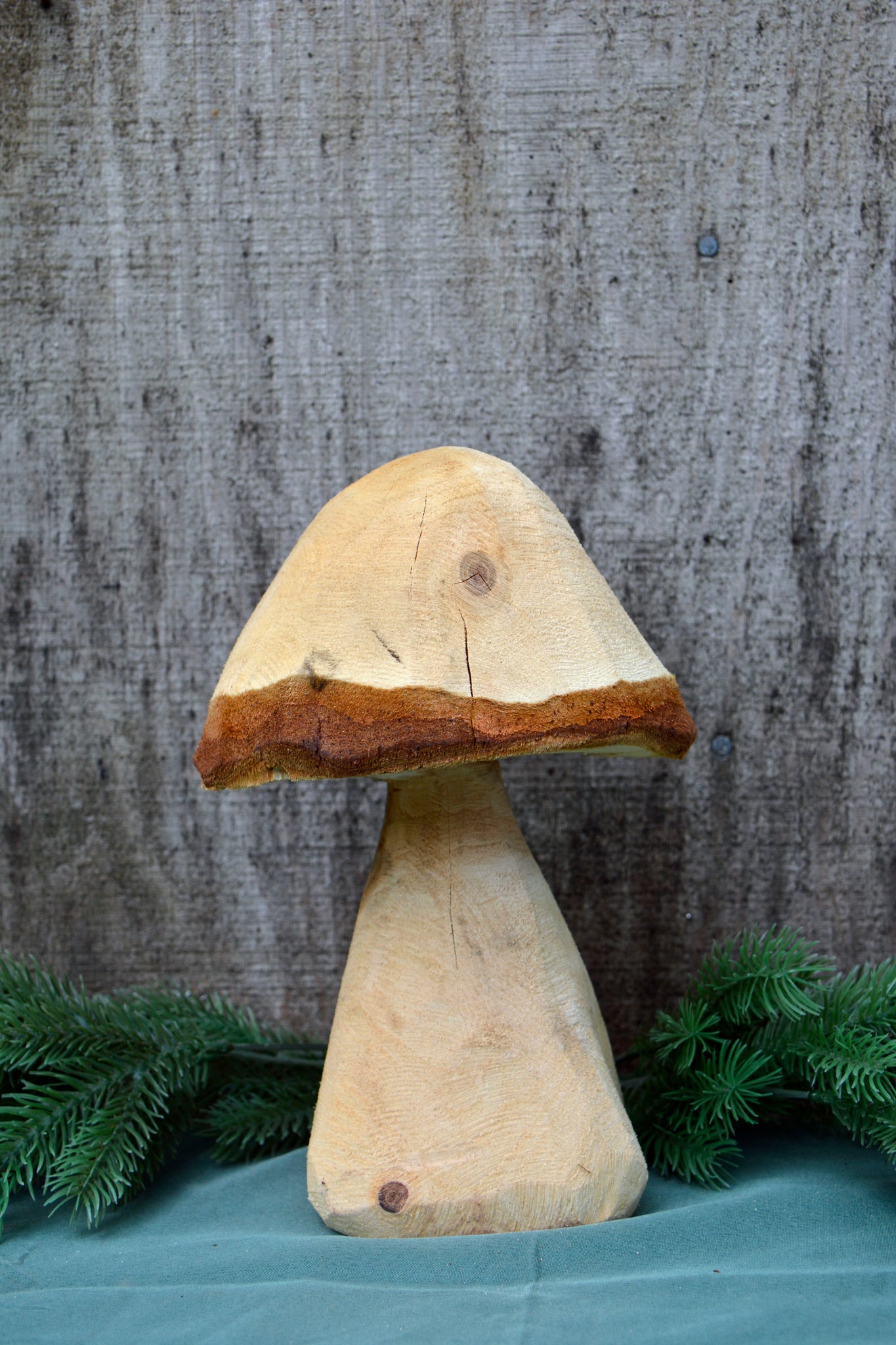 cute carved wooden mushrooms are made with a chain saw, and